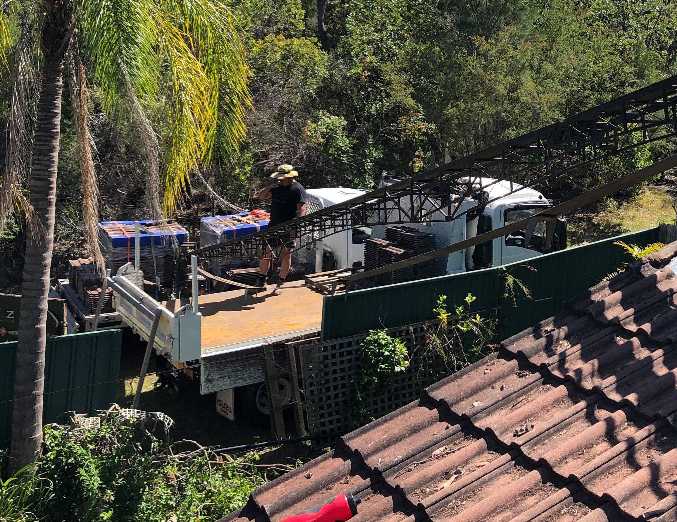 Tipper delivering roofing materials